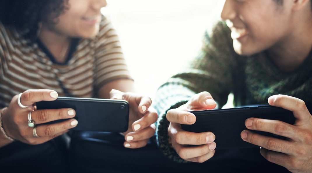 Couple playing online mobile game