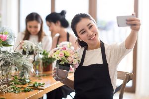 Young women learning flower arrangement