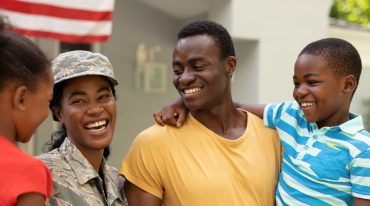 Book Cheerful female mid-adult african american soldier (Photo via Envato Elements)